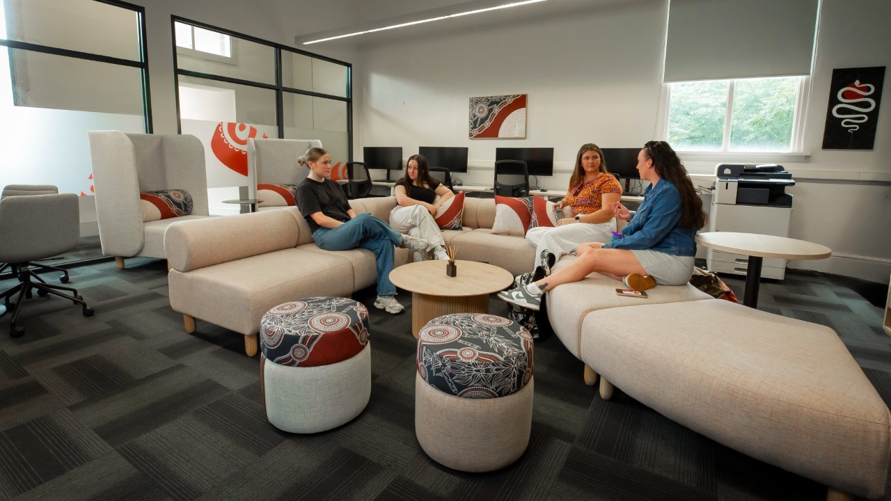 Four students sitting in the Indigenous Student Lounge.