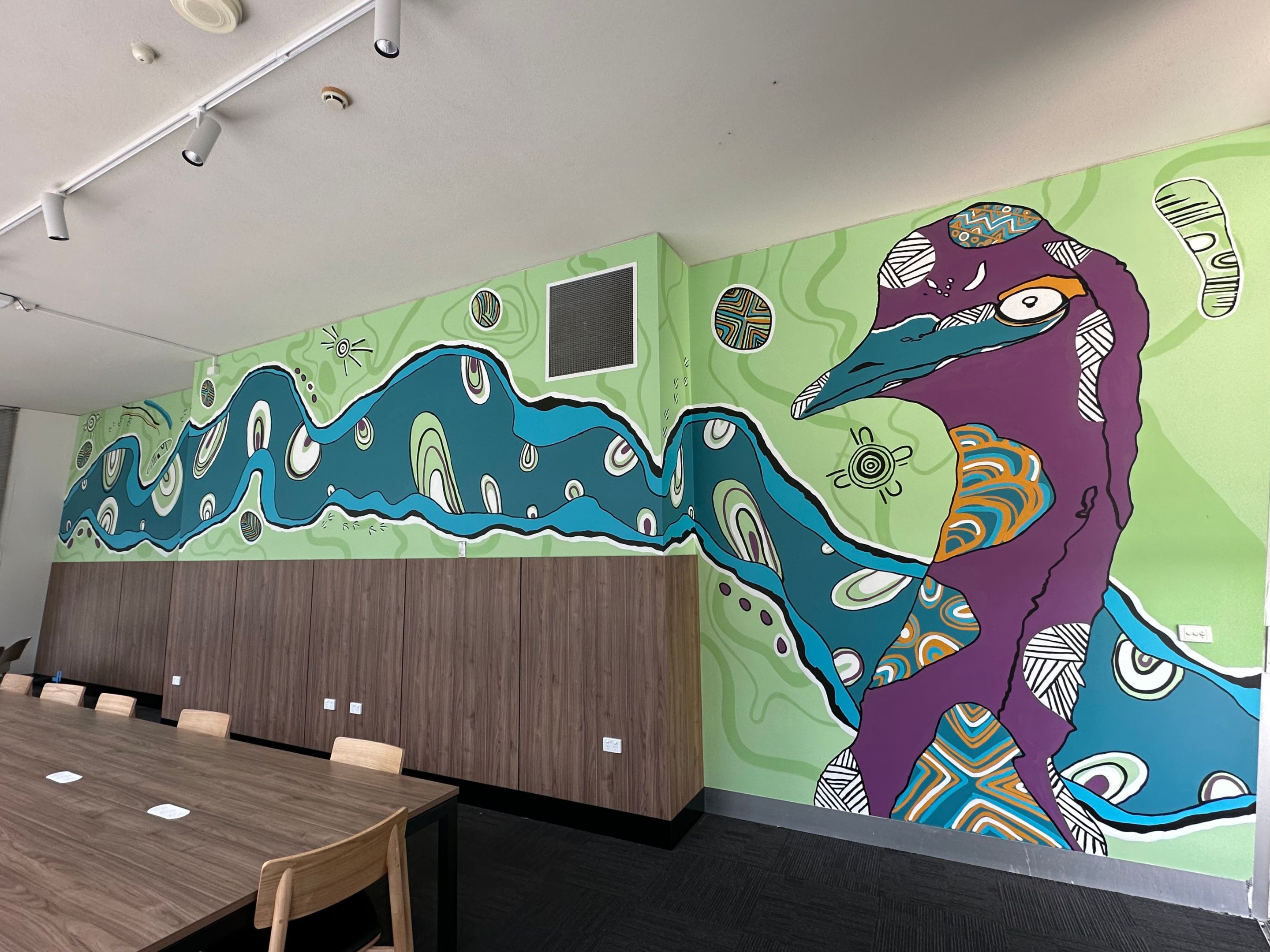 AGSE Artwork 3 Indigenous artwork by Mandi Barton, featuring an emu, bright colours and flowing lines along a wall.