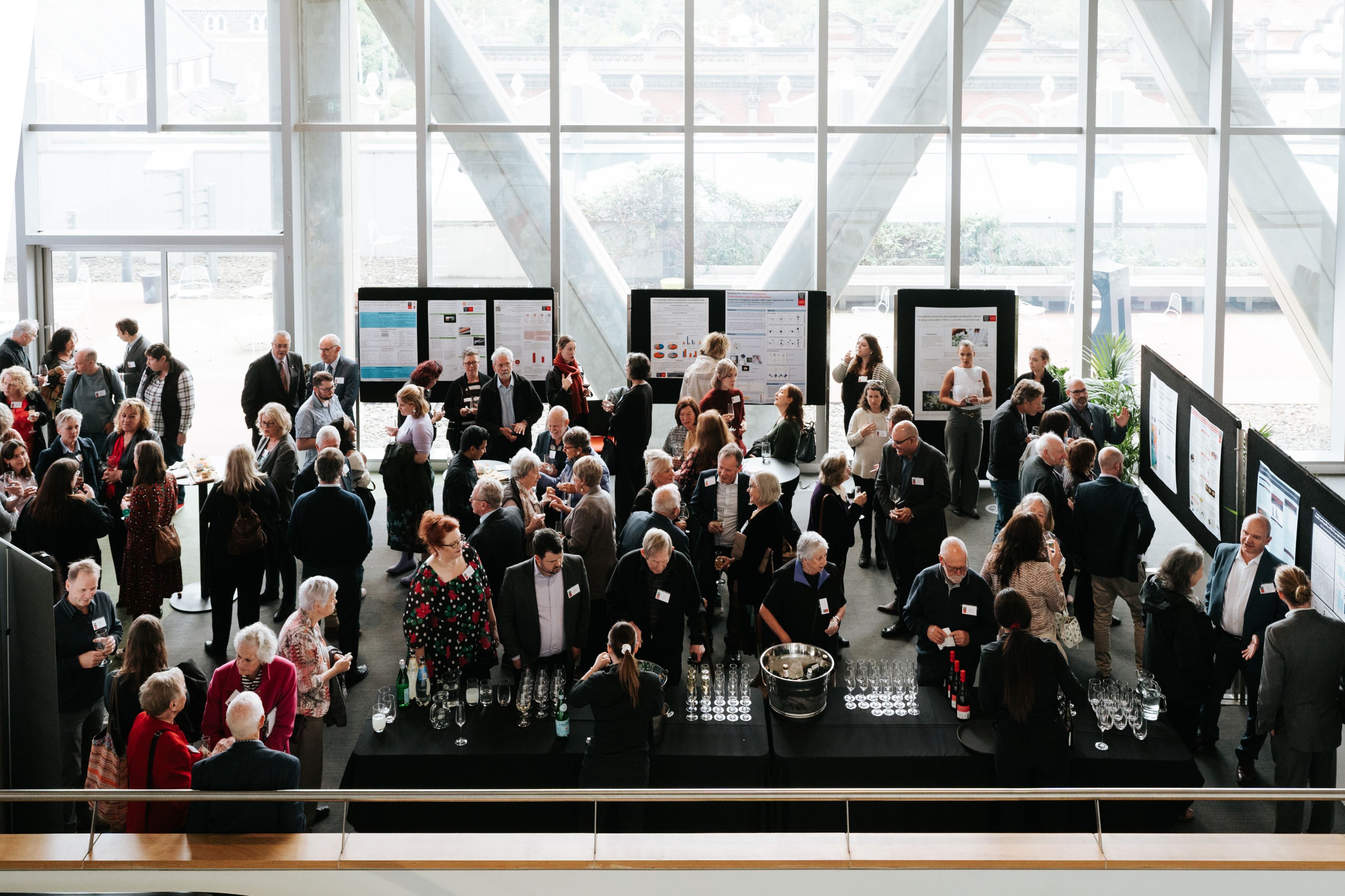 Image of a Barbara Dicker Brain Sciences Foundation event with attendees discussing mental health research