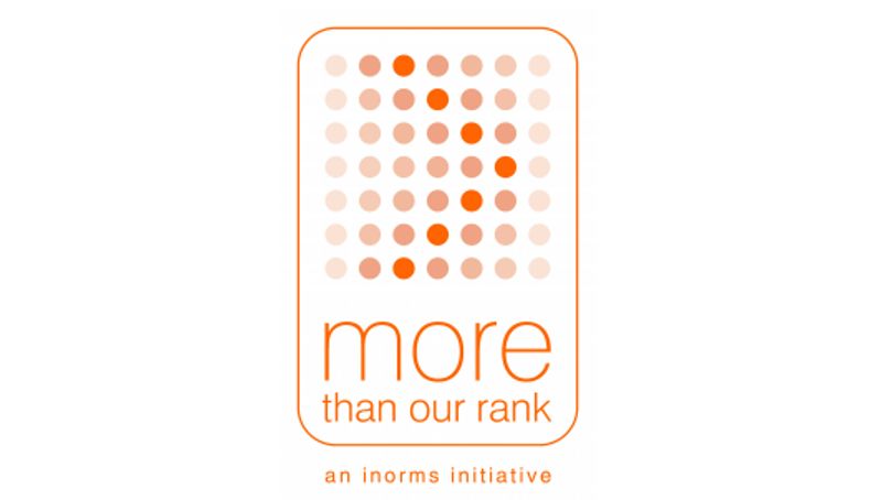 Orange logo with dots at the top and words at the bottom