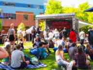 Band playing at an event in the common outdoor area of the Hawthorn campus