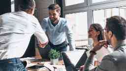 Young corporate professionals engaging over a meet and greet. at work