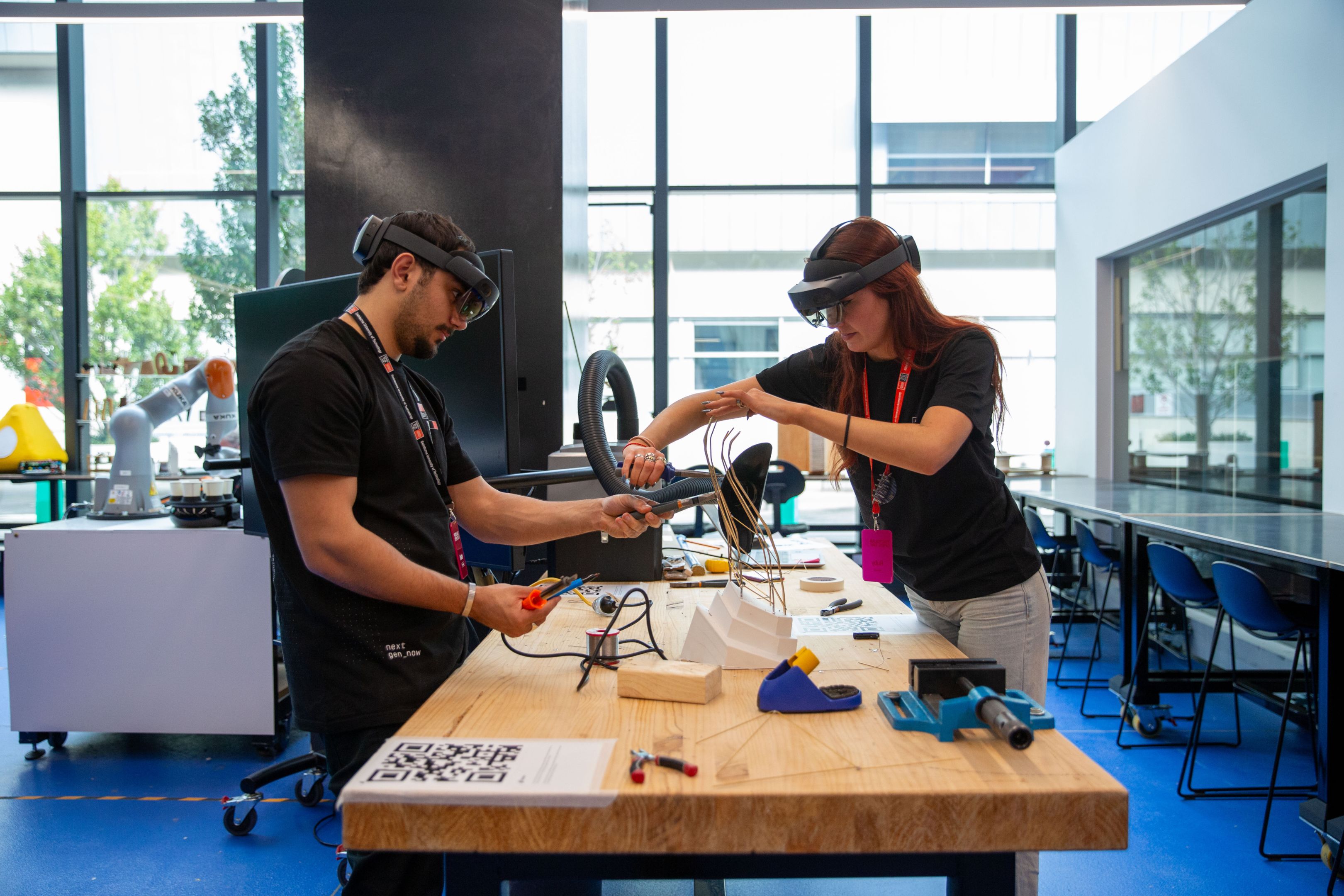 Two students wearing VR headsets at Swinburne Open Day 2024. 
