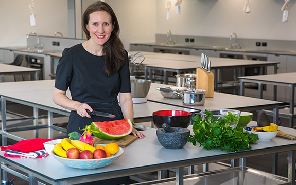 Regina Belski preparing food. 