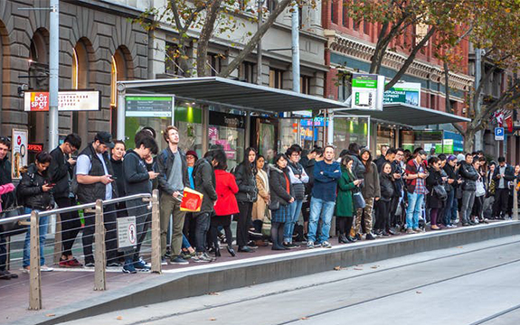 Crowded Melbourne tram stop