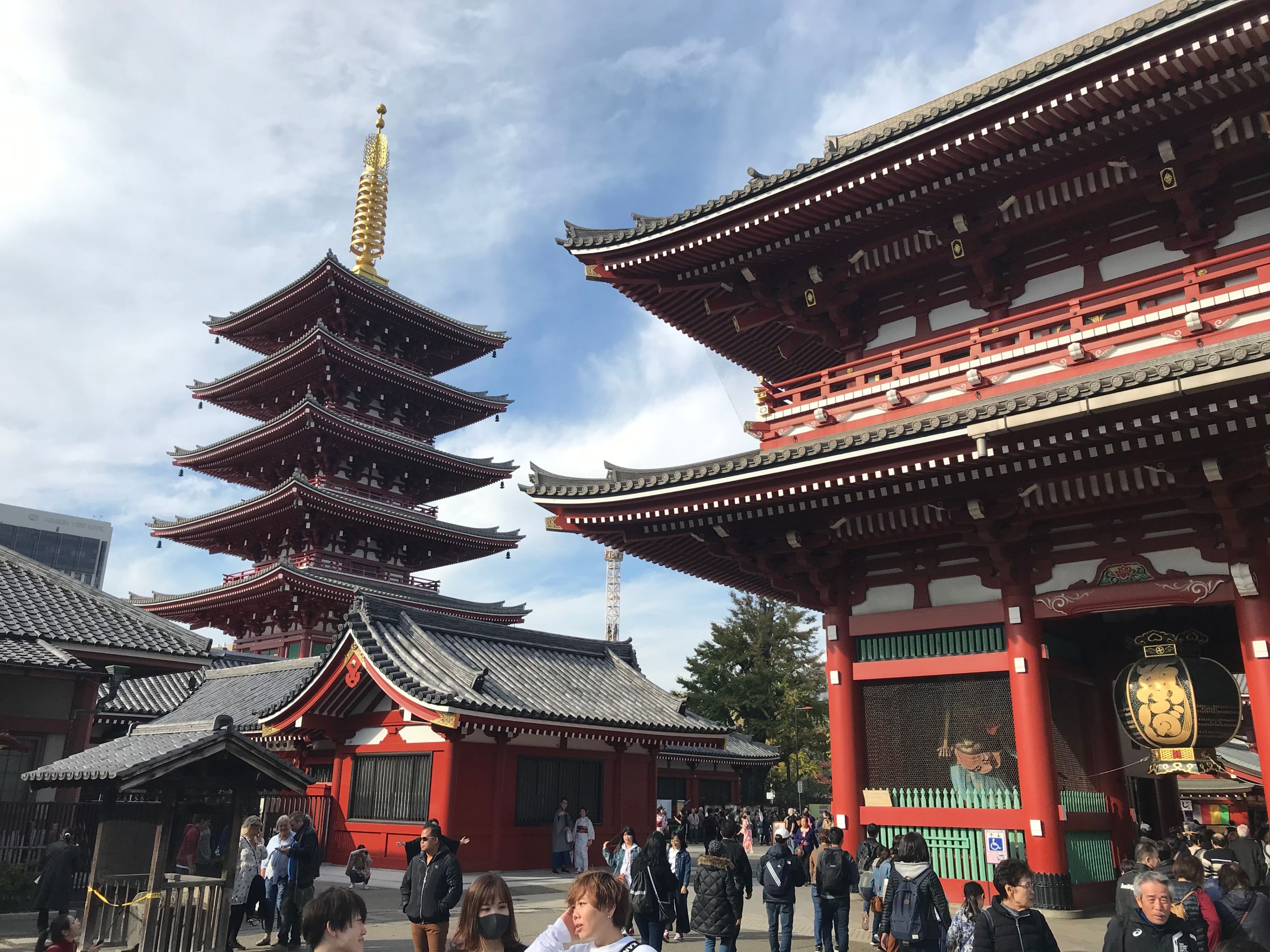 Asakusa Temples, Japan An image of tourists viewing Japanese red temples