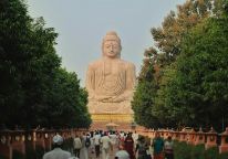 View of a crowd heading towards a temple shaped like a person in India