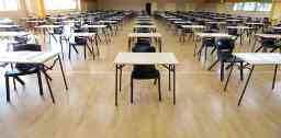 Interior inside view of an exam hall set up in preparation for a major assessment test or examination.