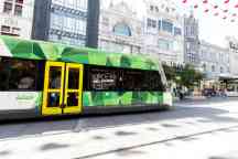 Tram passing through a Melbourne street
