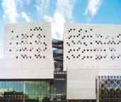 The front of the ATC building as with its architecturally-designed facade and white panels  