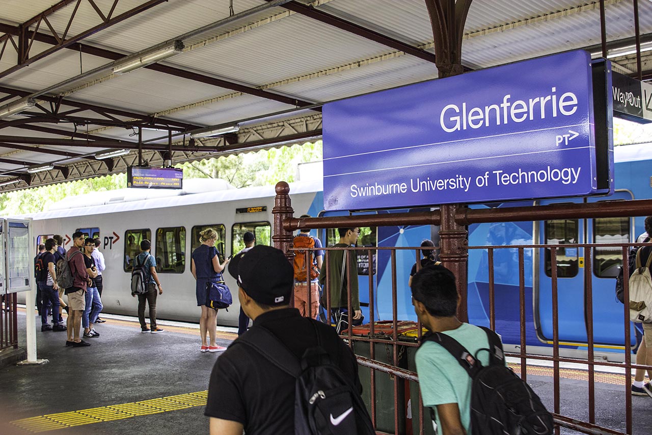 People getting on the train at Glenferrie Station.