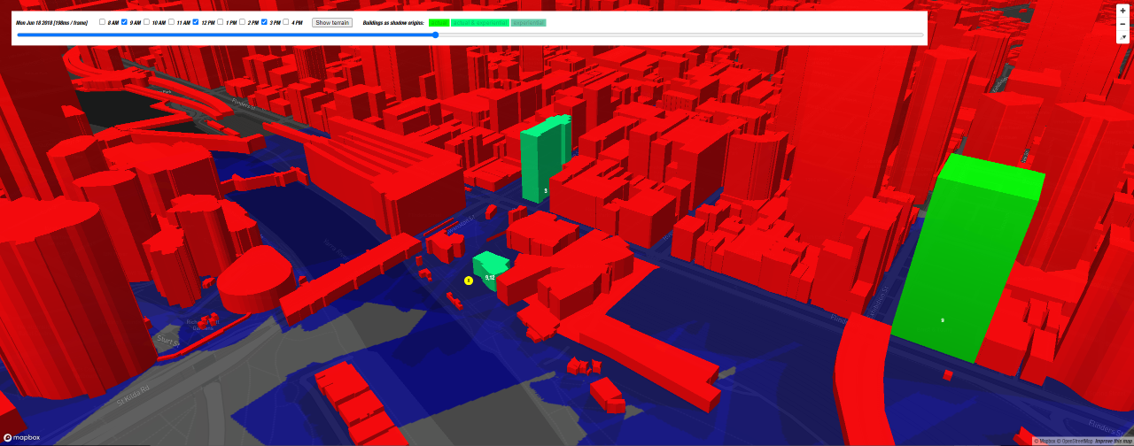 A computer-generated image showing a bird's eye view of a city with the buildings in red and green, on top of blue ground.