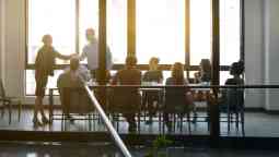 A group of people having a meeting in an office room