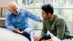 A male therapist and a male client in a counselling session