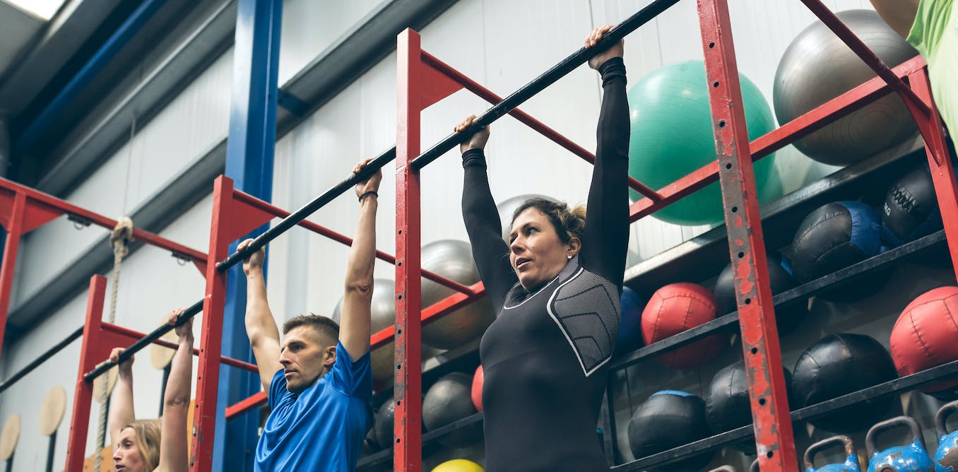 Group of people 'dead hanging' in a gym