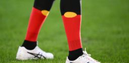 Sports player wearing Aboriginal Flag socks