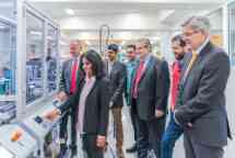 A group of Siemens representatives take a tour of Swinburne's robotics and engineering lab 
