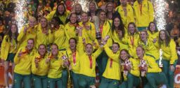 The Australian Diamonds netball team holding up the Netball World Cup trophy