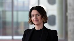 Lady with short brown hair in black suit in AMDC Building