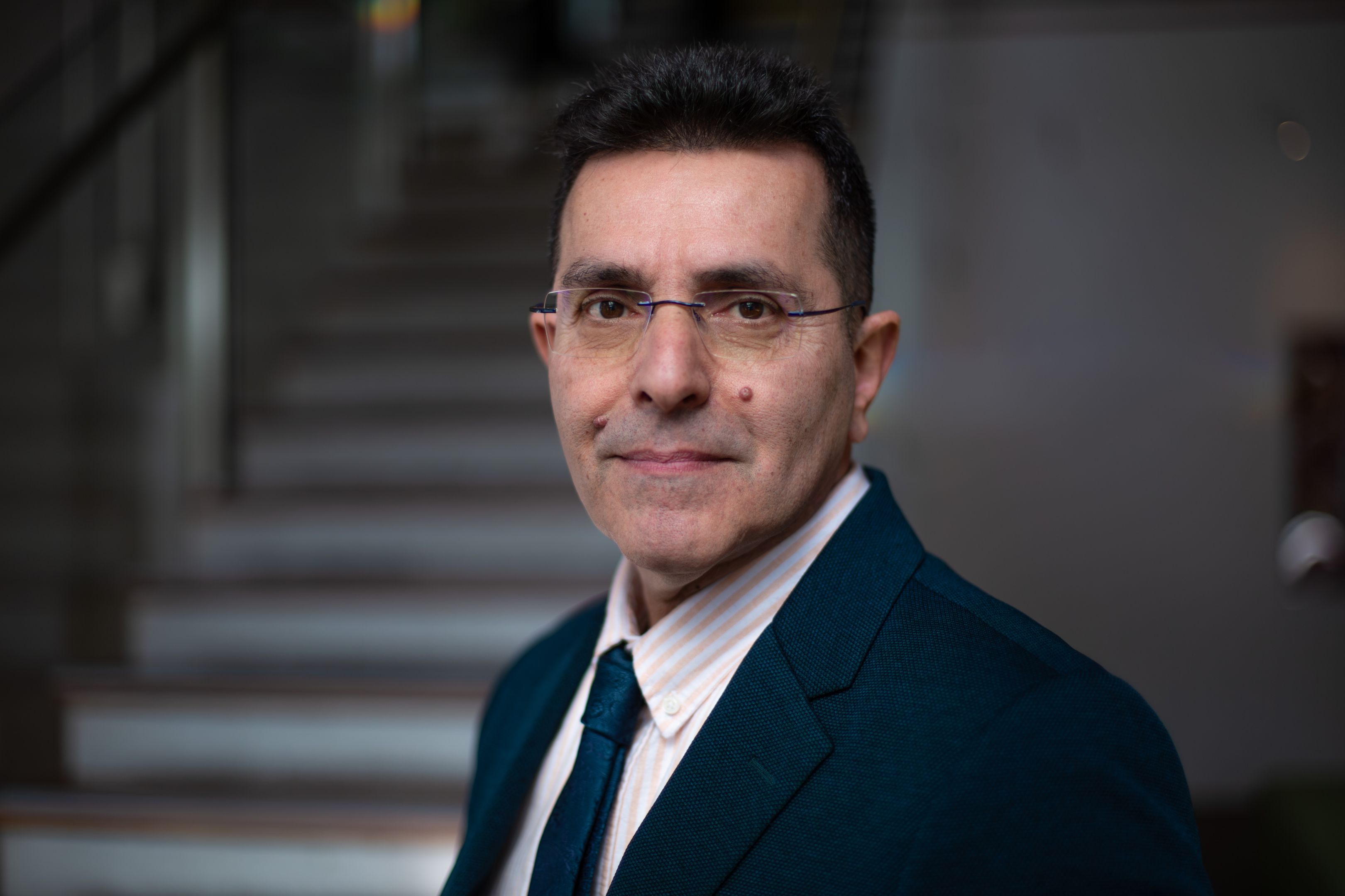 Saeid Nahavandi Man with glasses in a suit  standing slightly side on looking at the camera.