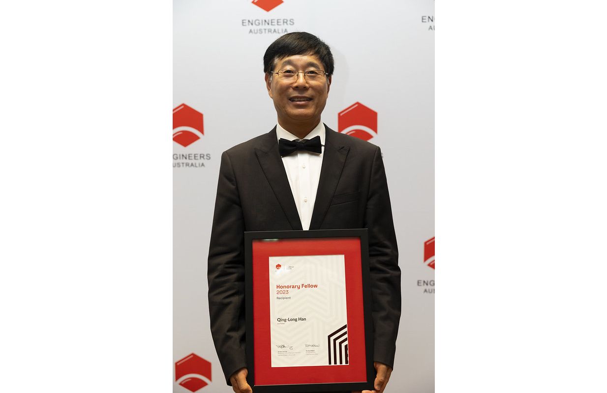 Person posing with award