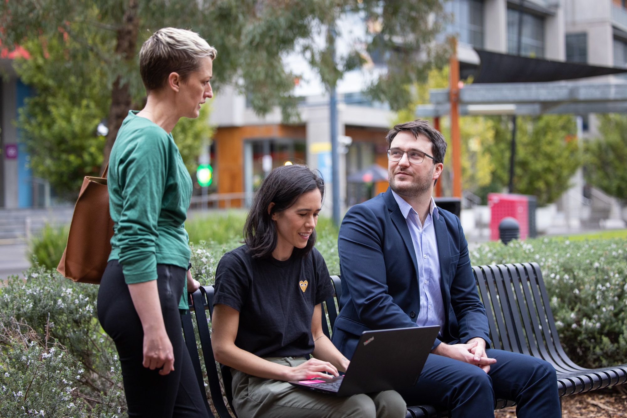 Three people all talking about work matters