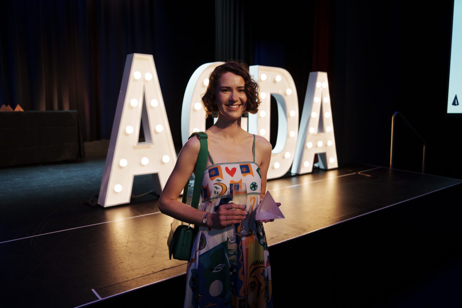 Alum Maddy Merzvinskis AGDA Emerging Designer Award Alum Maddy Merzvinskis holding the Emerging Designer Award given by the Austrailan Graphic Design Association