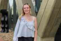 young woman smiling in external modern location