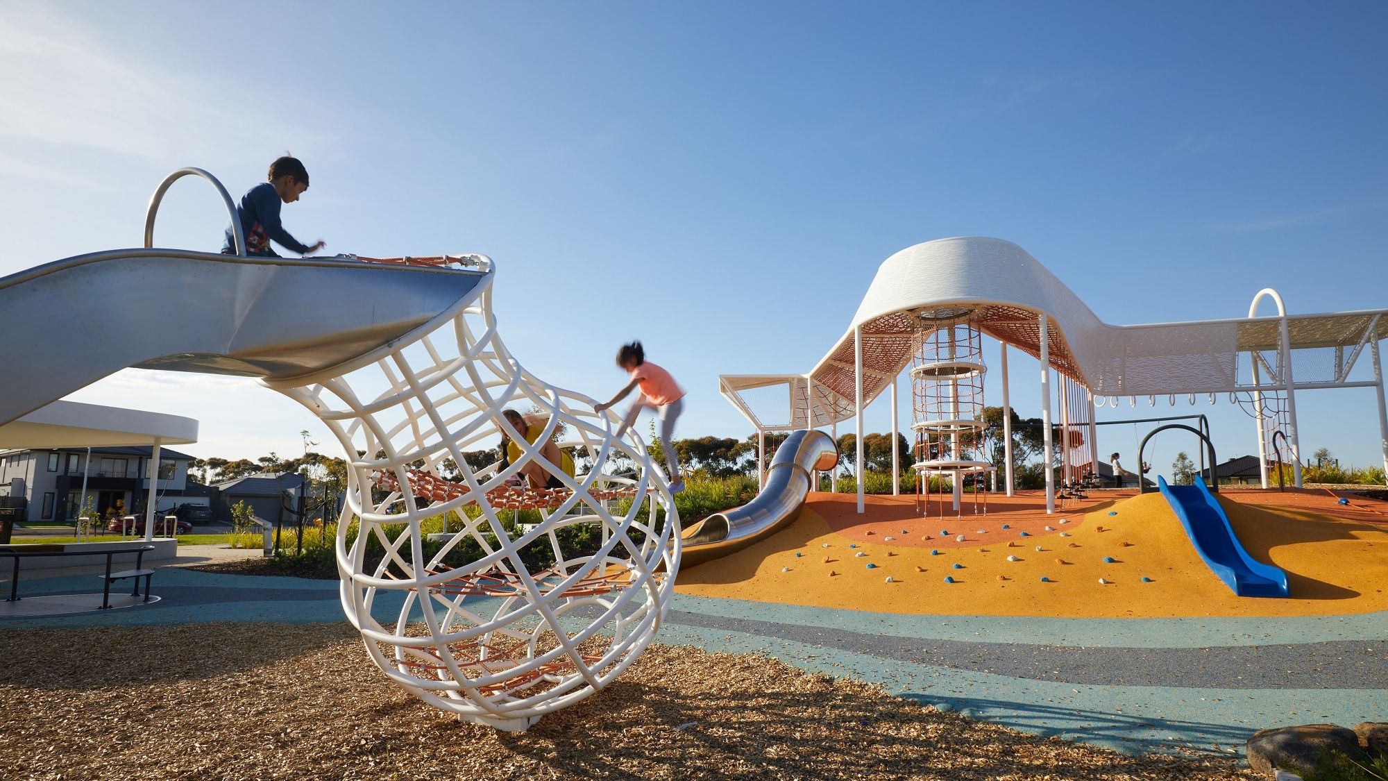 A gum-nut shaped metal structure that forms a ladder for a small slide