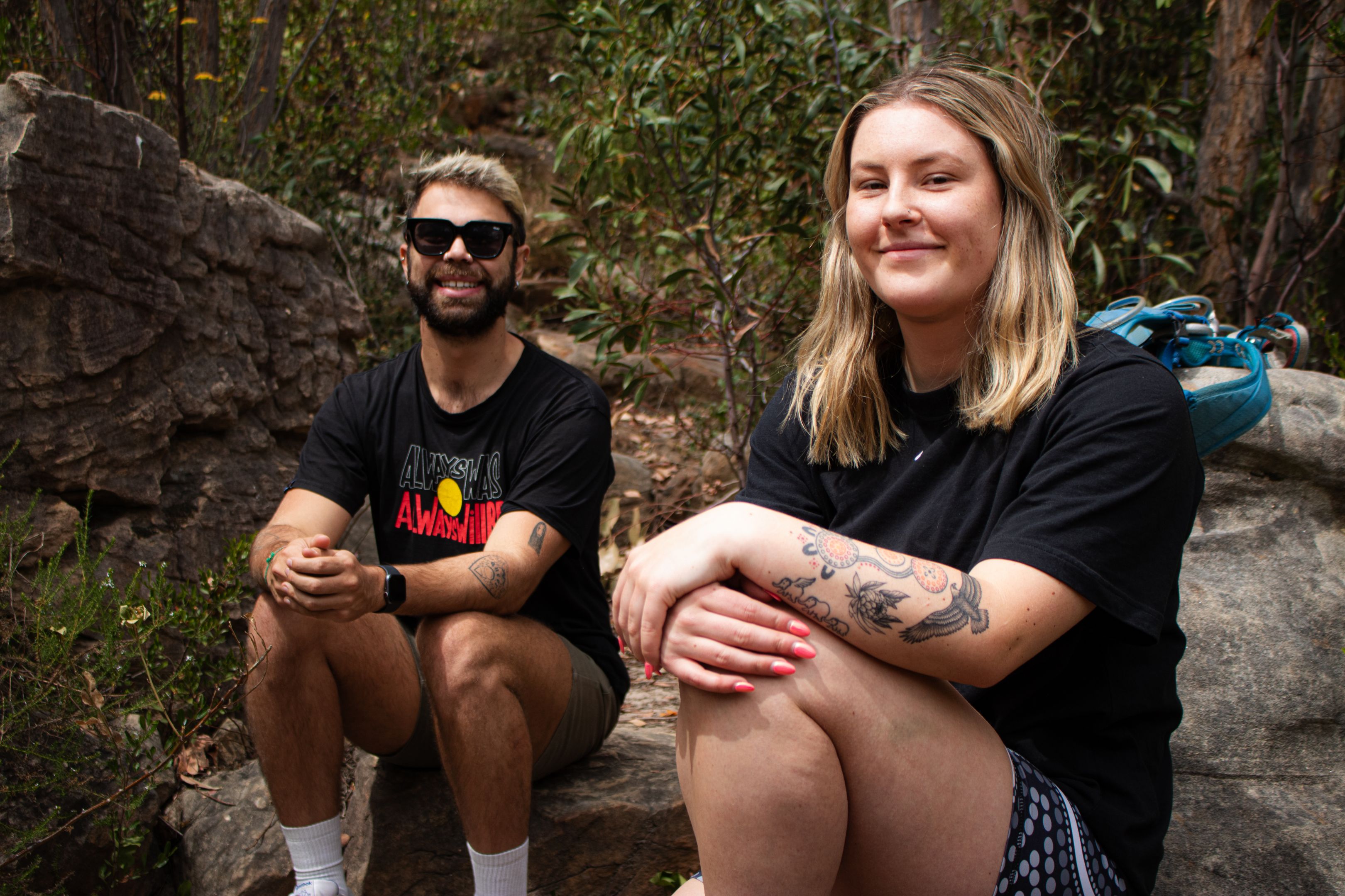 Two participants of the MTC On-Country Development Program relaxing in nature.