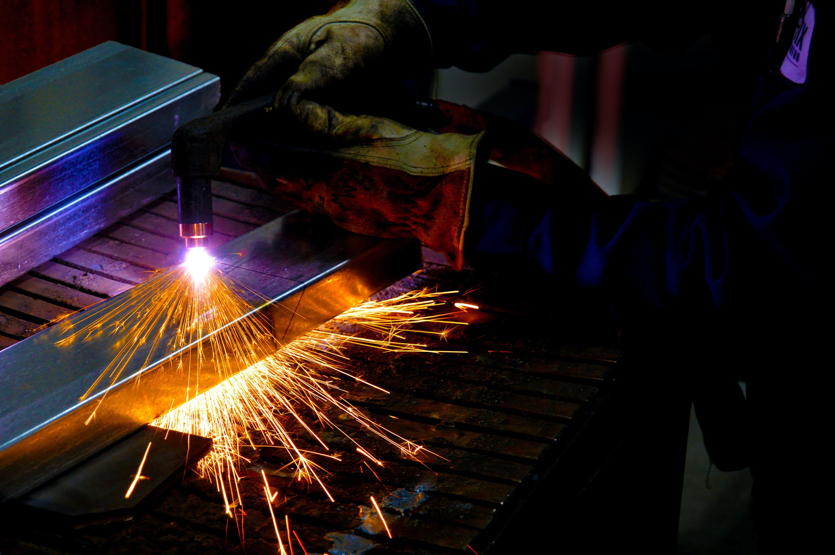 A welder at work, sparks fly