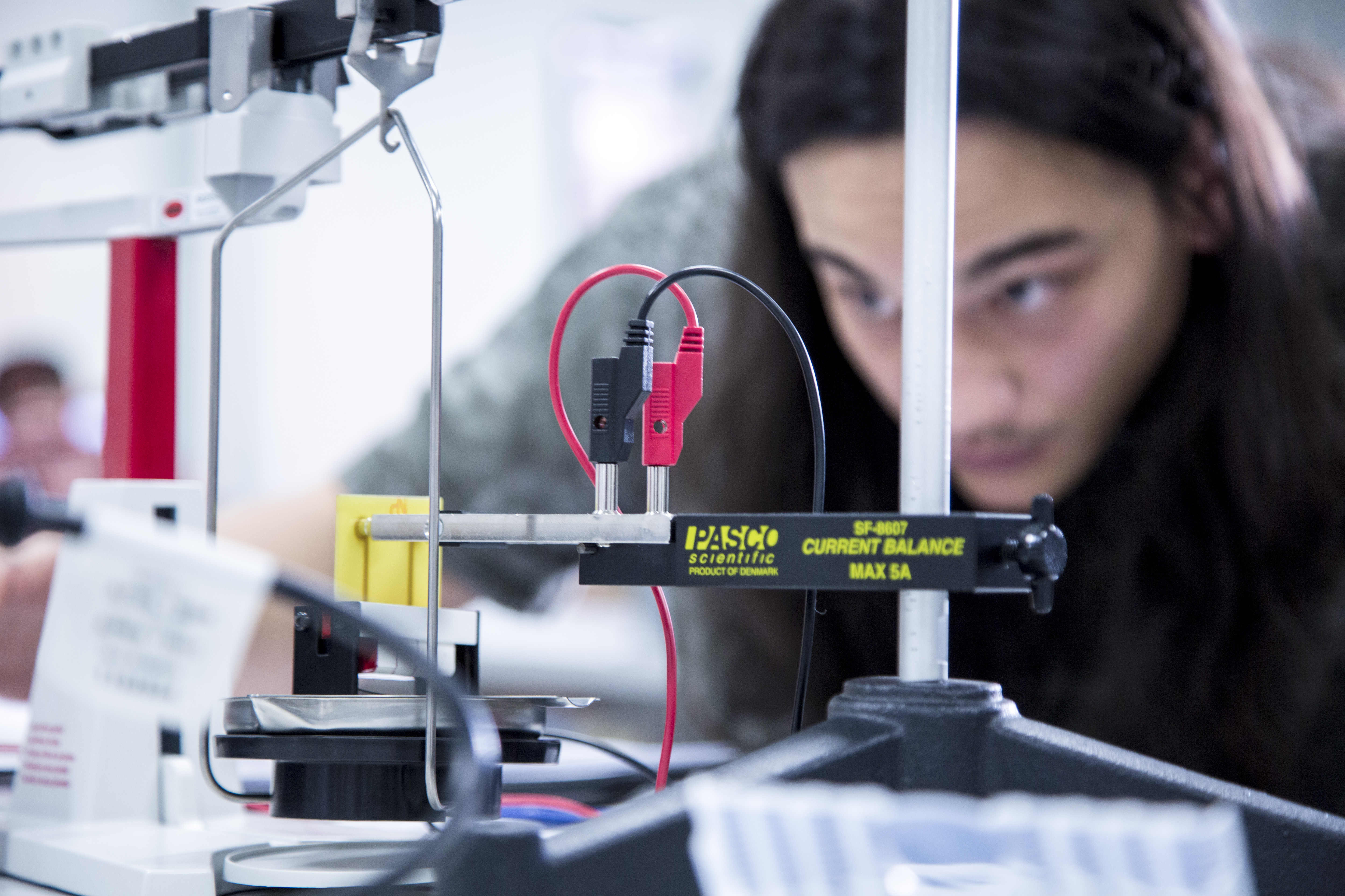 A student conducting a physics experiment.