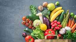 Shopping bag full of fresh vegetables and fruits