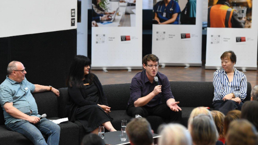 A group of people sitting in a circle talking