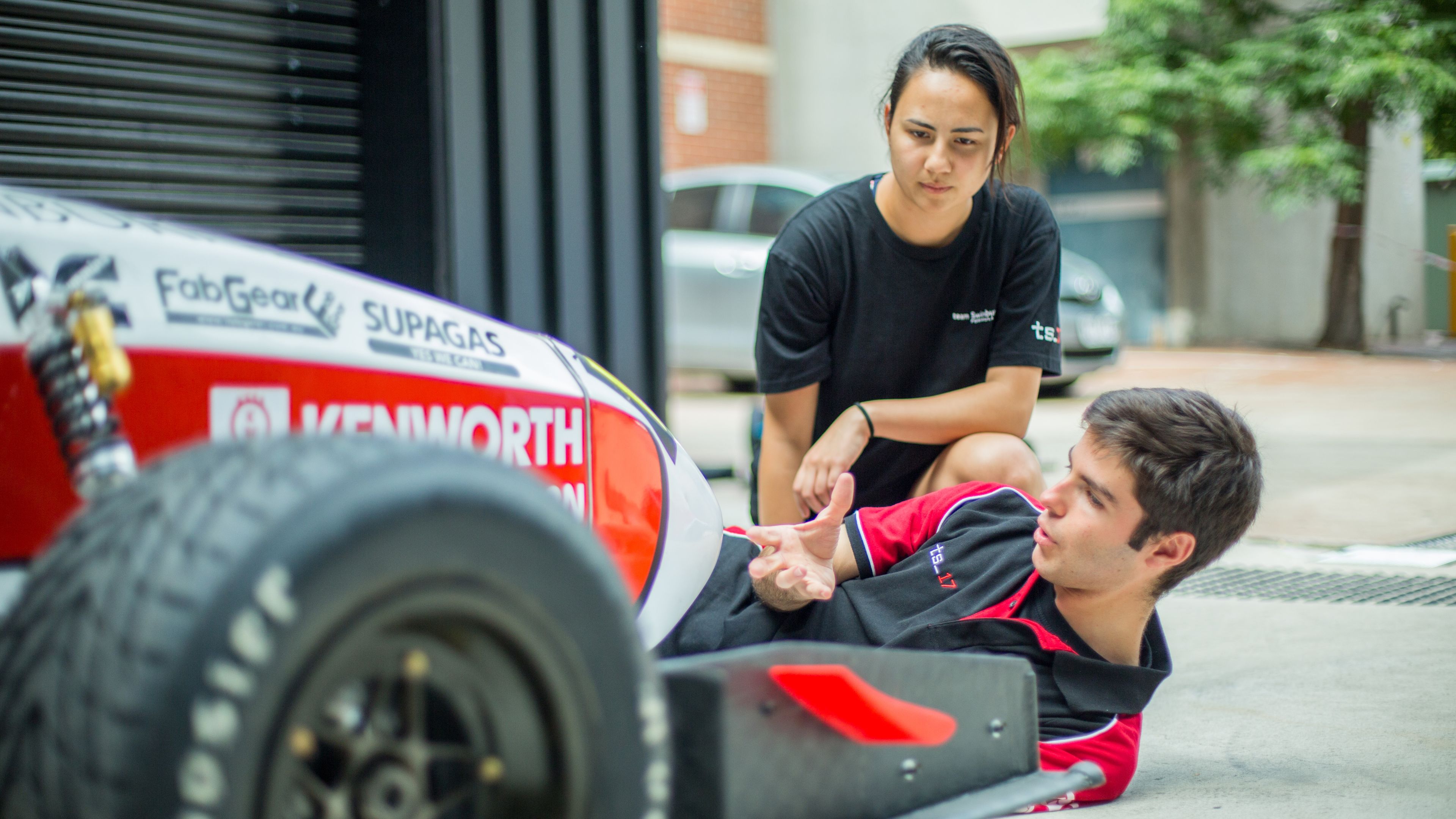 Tom breaks down the race car setup, pointing out key details.