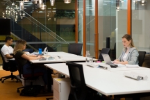 studying together large desk laptop open